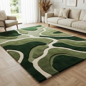 May include: A green rug with a distinctive, layered design. The rug showcases diverse shades of green, forming a landscape-inspired pattern with off-white pathways. The rectangular rug adds a modern touch to the room.