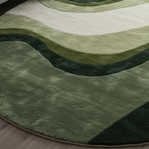 May include: A round area rug with a wave-like pattern in shades of green and off-white. The rug's design features flowing, curved lines, creating a sense of movement. The rug is made of a soft, plush material.