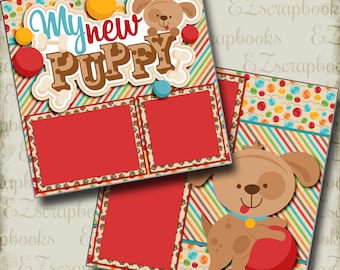 May include: A scrapbook page template with a red, white, and blue color scheme. The page features a cartoon puppy with a red ball, and the text "My new puppy". There are two photo spaces on the page.