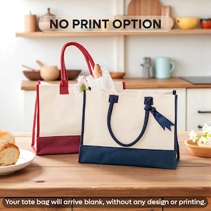 two tote bags, one red and one white, placed on a wooden table. The bags are empty and do not have any design or printing.