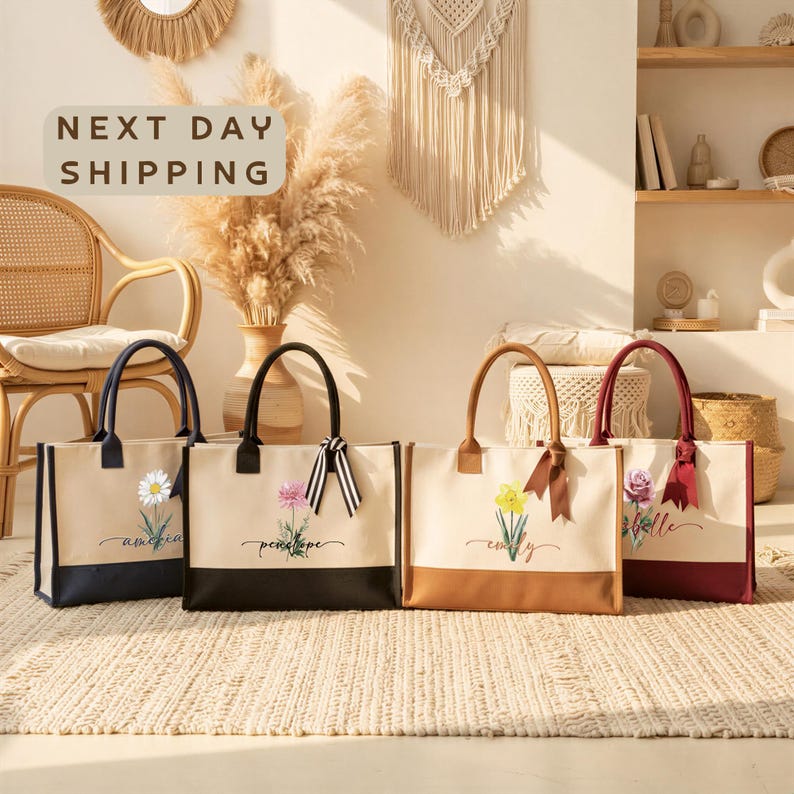 four handbags with floral designs, arranged on a beige rug in a room with a woven chair and a wall with a hanging plant.
