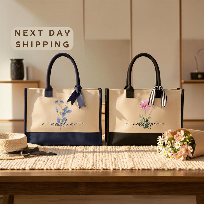two tote bags with personalized names and floral designs, placed on a wooden surface.