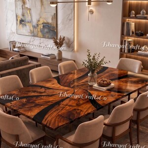 May include: A large, rectangular wooden dining table with a dark epoxy resin design, surrounded by beige upholstered chairs. The table is set in a modern dining room with a large painting and a bookshelf. The table measures approximately 100 inches long.
