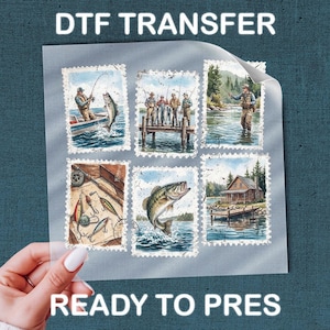 May include: A clear sheet with six postage stamp-style images featuring fishing scenes. The images include fishermen in boats and on docks, fish jumping, and fishing gear. The text "DTF TRANSFER" and "READY TO PRES" are visible.