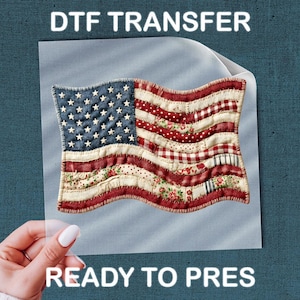 May include: DTF transfer of a patchwork American flag design. The flag features a blue field with white stars and red and white stripes with floral and gingham patterns. The words "DTF TRANSFER" and "READY TO PRESS" are printed above and below the flag.