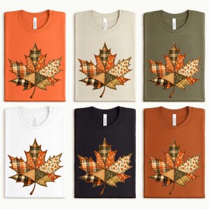 six T-shirts, each with a unique design featuring a leaf pattern. The leaf patterns are composed of various colors and patterns, creating a visually appealing and diverse collection of autumn-themed T-shirts.