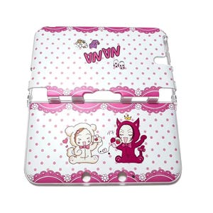 May include: A white and pink Nintendo 3DS case with a polka dot pattern and decorative lace trim. The case features cartoon illustrations of characters in animal costumes and the word "NANA".