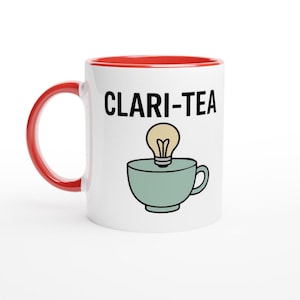 May include: White ceramic mug with a red interior and handle. The mug features the text "CLARI-TEA" in black, with a lightbulb above a teal teacup illustration. The mug is designed for hot beverages.