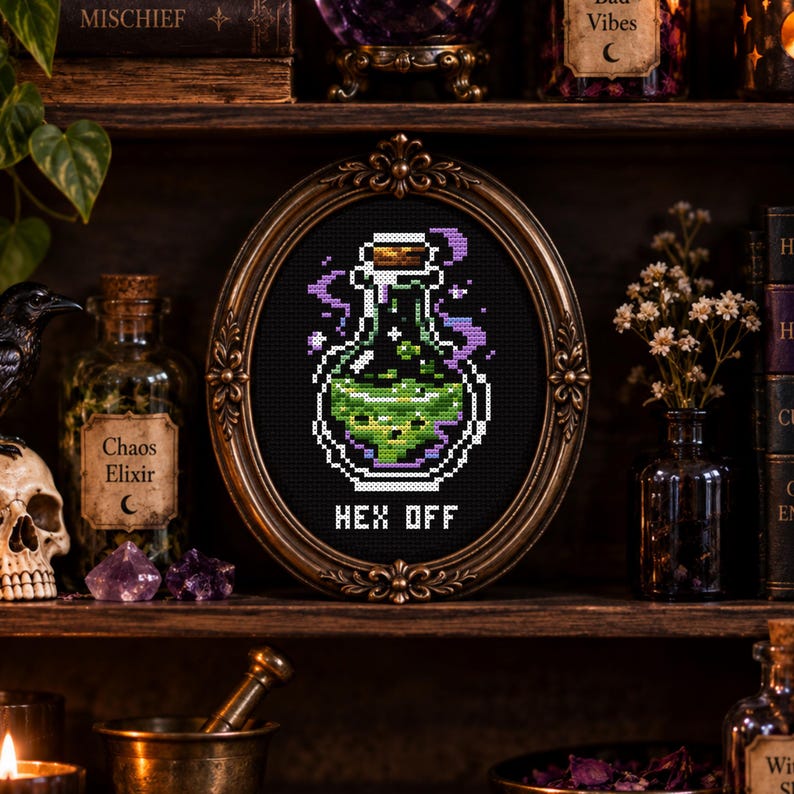 May include: A cross-stitch embroidery in an oval bronze-toned frame featuring a pixelated glass bottle filled with a glowing green liquid. Purple smoke swirls around the bottle, and the text "HEX OFF" is stitched in white below the bottle.