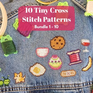 May include: A denim jacket adorned with tiny cross-stitch patterns of various objects, including a cookie, egg, and wine glass. The jacket also features the text "10 Tiny Cross Stitch Patterns Bundle 1-10". Embroidery floss and a hoop are also visible.