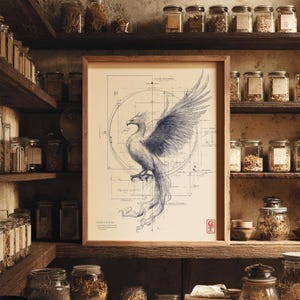May include: A framed print featuring a detailed blue and white illustration of a phoenix with outstretched wings. The artwork is set against a blueprint-style background with circular and linear elements. The print is displayed on a wooden shelf with jars.