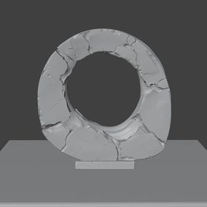May include: A gray, abstract sculpture with a circular opening. The sculpture has a rough, textured surface, resembling cracked stone. It stands on a rectangular base, with a dark gray background.
