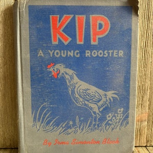 May include: A vintage book titled "Kip, A Young Rooster" by Irma Simonton Black. The cover features a blue background with a red and white rooster illustration.