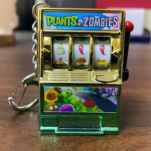 Llavero mini tragamonedas de Plants vs. Zombies / Juguete antiestrés retro / Regalo para gamers