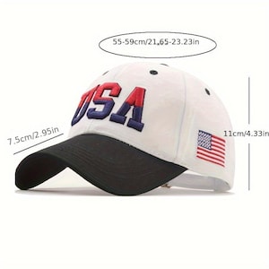 May include: White baseball cap with a black brim. The word "USA" is embroidered in red and blue on the front. An American flag patch is on the side. The cap measures 11cm/4.33in high and 55-59cm/21.65-23.23in in circumference.