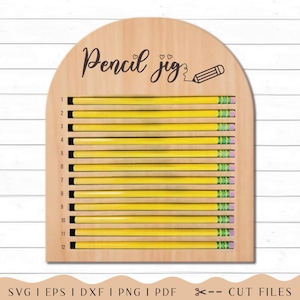 May include: A light-colored wooden arch-shaped pencil jig featuring the text Pencil jig with two small hearts and a pencil icon. It includes twelve horizontal slots numbered one through twelve, each holding a yellow pencil with a pink eraser.