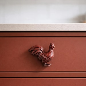 May include: A set of three ceramic mugs with a speckled, matte finish. The mugs are in shades of cream, light gray, and dark gray. Each mug has a simple, minimalist design, perfect for coffee or tea.