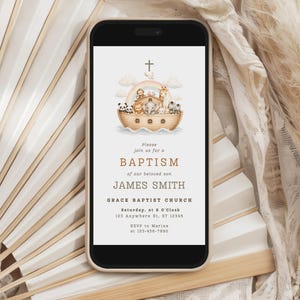 May include: A smartphone displaying a digital baptism invitation featuring a watercolor illustration of Noah's Ark with animals, a cross, and text including "BAPTISM of our beloved son JAMES SMITH" and "GRACE BAPTIST CHURCH" with event details.