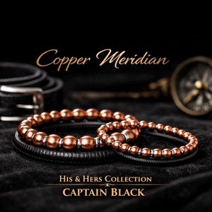 May include: Two copper beaded bracelets, one larger and one smaller, rest on a black leather band. The bracelets are part of the "His & Hers Collection" and are labeled "CAPTAIN BLACK". The image also includes a black belt and a compass.