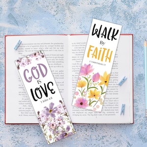 May include: Two decorative bookmarks with floral designs and inspirational quotes. One bookmark reads "GOD IS LOVE 1 John 4:8" in purple and black. The other says "WALK BY FAITH 2 CORINTHIANS 5:7" in black and yellow.
