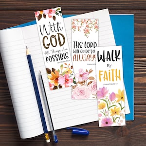 May include: Three floral bookmarks with inspirational quotes. One bookmark reads "With God, All Things Are Possible." Another says "The Lord Will Guide You Always." The third says "Walk By Faith."