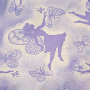 May include: A light purple fabric with a repeating pattern of fairies and butterflies. The fairies are in silhouette, reaching for the butterflies. The background has a soft, cloudy effect.
