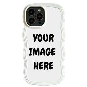 May include: White phone case with a wavy border and a camera cutout. The case has the text "YOUR IMAGE HERE" in a bold, black font, perfect for customization. The case is designed to fit a smartphone.