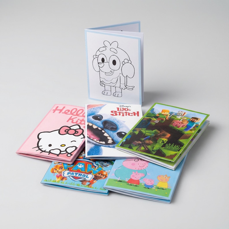 May include: A collection of children's coloring books and activity books featuring popular characters. The books include Hello Kitty, Stitch, Minecraft, Peppa Pig, and Paw Patrol. The books have colorful covers and are stacked on a white surface.