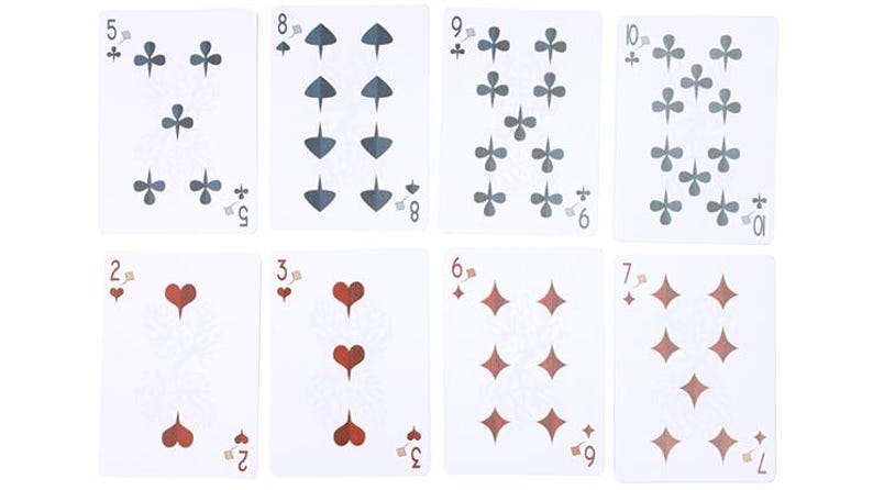 May include: Eight playing cards are displayed, showcasing various suits and numbers. The cards feature clubs, spades, diamonds, and hearts in gray and red. Numbers range from 2 to 10, with the suit symbols arranged accordingly. The cards are on a white background.