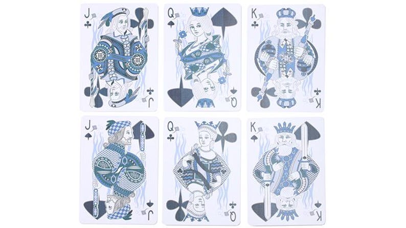 May include: Six playing cards featuring Jacks, Queens, and Kings in a blue and white color scheme. Each card displays a unique illustration of a royal figure with traditional suit symbols. The cards are arranged in two rows of three.