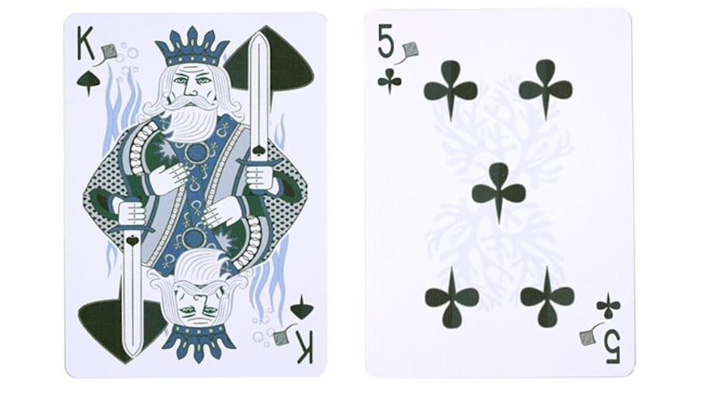 May include: Two playing cards on a white background. The King of Spades card features a king holding a sword, with blue and green accents. The other card is the Five of Clubs, with five black clover symbols.