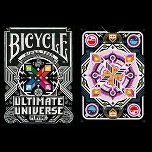 May include: A Bicycle Ultimate Universe playing cards deck. The card backs feature a geometric design in shades of purple, orange, and blue on a black background. The card faces have a black and white design with the Bicycle logo and the words "Ultimate Universe Playing Cards."