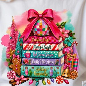 May include: A white t-shirt featuring a graphic of five stacked books with titles Christmas Magic, Merry & Bright, Hot Cocoa Season, North Pole Stories, and Holiday Happiness. The stack is topped with a disco ball and pink bow, surrounded by gingerbread, ornaments, and lights.