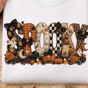 May include: A white sweatshirt featuring the word SPOOKY in large, decorative letters. Each letter has a unique pattern including plaid, leopard print, and checkered designs. The graphic includes ghosts, pumpkins, black bows, and stars.