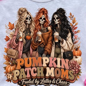 May include: White t-shirt featuring a graphic of three skeleton women with long hair, holding coffee cups, surrounded by fall foliage and pumpkins. The text "PUMPKIN PATCH MOMS" and "Fueled by Lattes & Chaos" are displayed in a retro font.