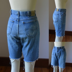 Vintage faded and distressed Cut off denim jean shorts by Lee women’s size 10 waist size 34 measured