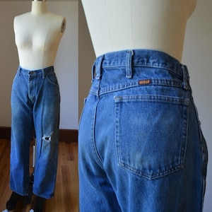 90’s Vintage Distressed And Faded Denim Jeans By Rustler Size 14, Vintage Well Worn Faded Denim Jeans Waist Size 37 Measured By Rustler