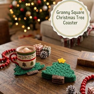 May include: A set of green crochet Christmas tree coasters with brown trunks and yellow star toppers. One coaster sits under a ceramic mug filled with a beverage and a marshmallow. A scalloped label reads Granny Square Christmas Tree Coaster.
