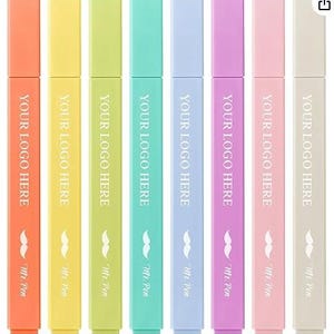 May include: A white ceramic mug with a black handle and the text "But First, Coffee" in a bold, black font. The mug is set against a blurred background, suggesting a cozy setting.