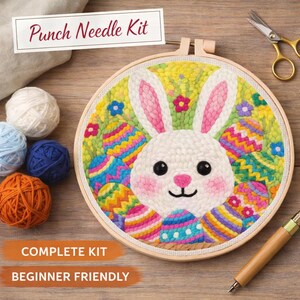 May include: A punch needle kit featuring a white bunny and colorful Easter eggs. The kit includes a wooden hoop, yarn, and a punch needle tool. Text on the image reads "Punch Needle Kit", "Complete Kit", and "Beginner Friendly".