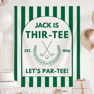 May include: A white and green banner with the text "JACK IS THIR-TEE" and "LET'S PAR-TEE!" in green. The banner has a golf theme, with crossed golf clubs and a golf ball. The year "1996" is also displayed.