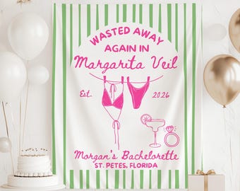 May include: A white banner with green vertical stripes and pink text that reads "Wasted Away Again in Margarita Veil" with a bikini illustration. The banner also says "Morgan's Bachelorette, St. Pete's, Florida" and "Est. 2026".