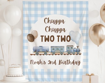 May include: A blue and white gingham backdrop with a train illustration and the text "Chugga Chugga TWO TWO" and "Noah's 2nd Birthday". The train is blue with brown accents. Balloons and a cake are in the background.