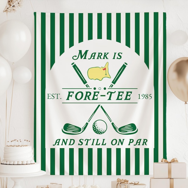 May include: A white banner with green vertical stripes and a golf-themed design. The banner features the text "Mark Is Fore-Tee 1985" and "And Still On Par" with golf clubs and a golf ball illustration. Balloons and a cake are in the background.