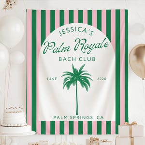 May include: A party backdrop with a white center featuring the text "Jessica's Palm Royale Bach Club" and a palm tree illustration. The backdrop has green and pink vertical stripes and the text "Palm Springs, CA" at the bottom. White and gold balloons are in the background.