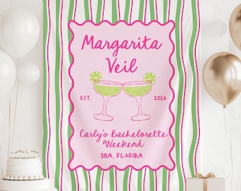 May include: A pink and green striped banner with the text "Margarita Veil" and "Carly's Bachelorette Weekend" in pink script. The banner features two margarita glasses with lime wedges. The banner is decorated with balloons and a cake.
