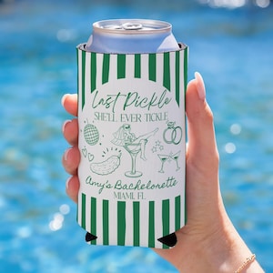 May include: A white and green striped can cooler with the text "Last Pickle Shell Ever Tickle" and "Amy's Bachelorette Miami FL" in green. The design includes illustrations of a disco ball, pickle, martini glass, and wedding rings.