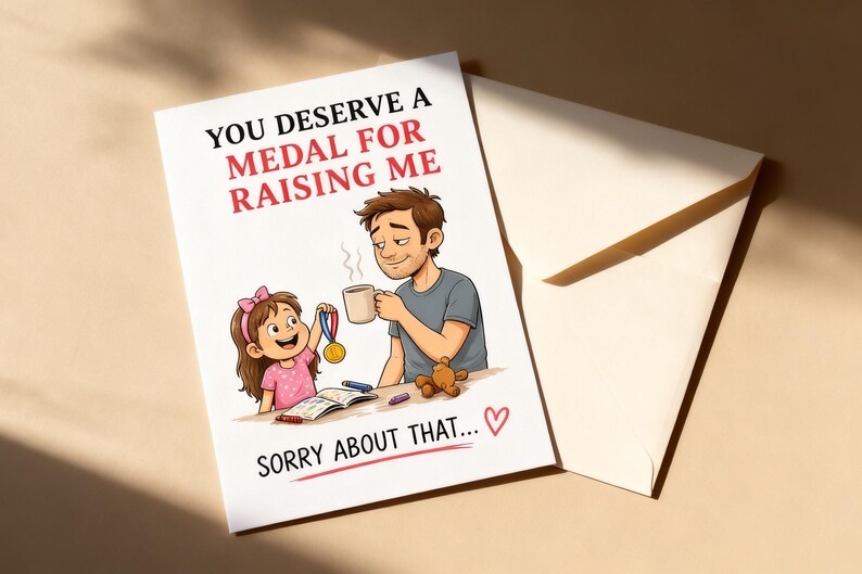May include: A greeting card with the text "YOU DESERVE A MEDAL FOR RAISING ME" and "SORRY ABOUT THAT..." features an illustration of a father and daughter. The daughter holds a medal, and the father holds a mug. An envelope is next to the card.