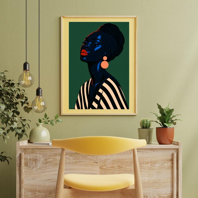 May include: Framed art print featuring a stylized portrait of a person with dark skin, wearing a black head wrap and striped top. The portrait has red lips and orange earrings, set against a dark green background.