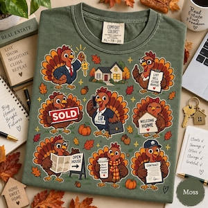 May include: An olive green t-shirt featuring a graphic print of multiple cartoon turkeys in various real estate roles. The turkeys are depicted with items like a sold sign, a contract, a house key, and a coffee cup, surrounded by autumn leaves.